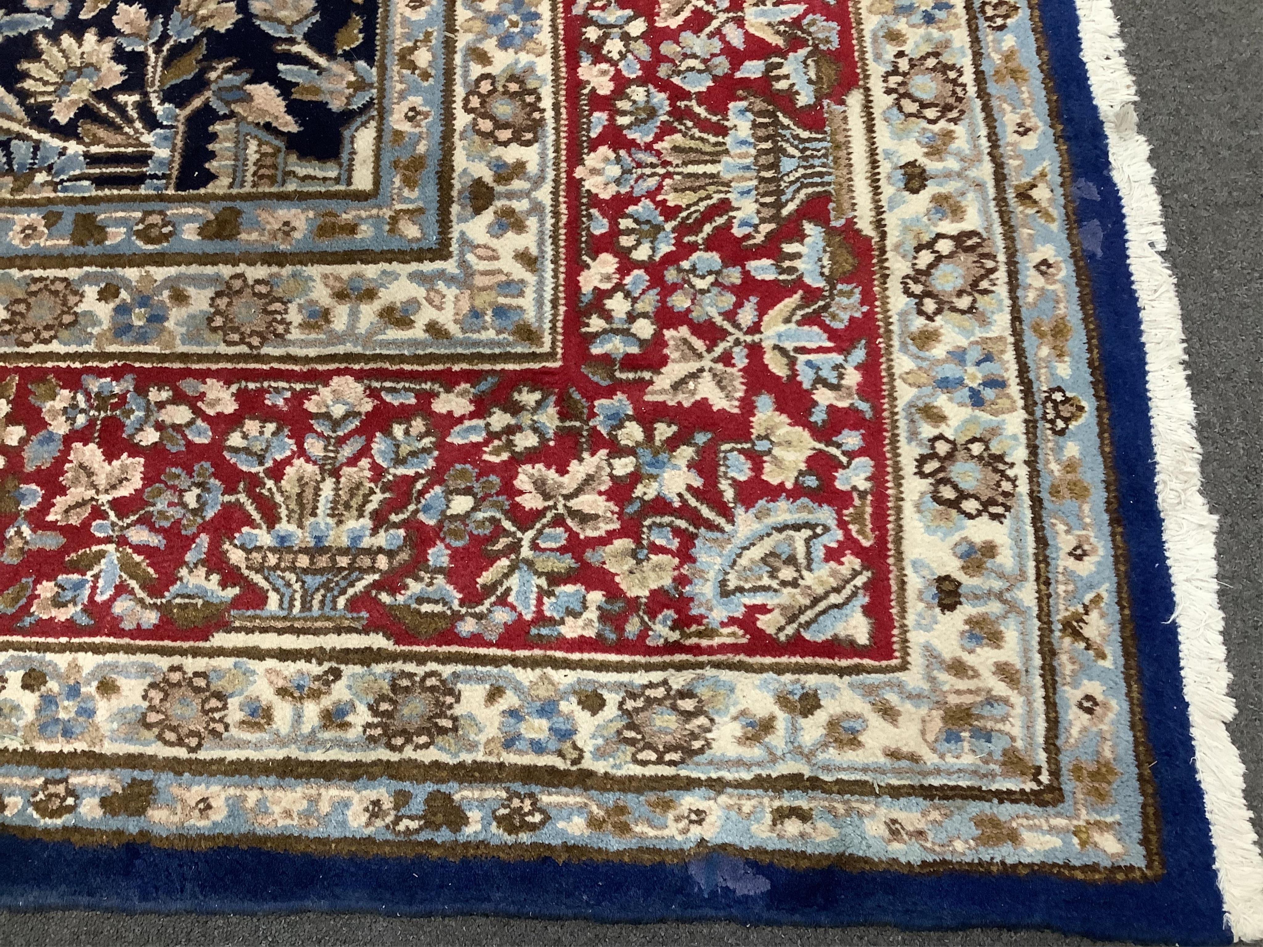 A North West Persian blue ground carpet, 394 x 284cm. Condition - good